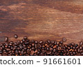Coffee beans on wood background 91661601