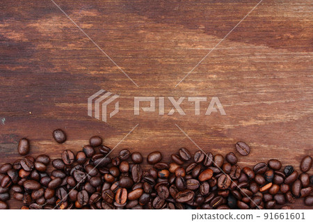 Coffee beans on wood background 91661601