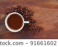 Coffee cup beans on wood background 91661602