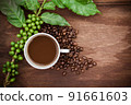 Cup coffee and beans on wood background 91661603
