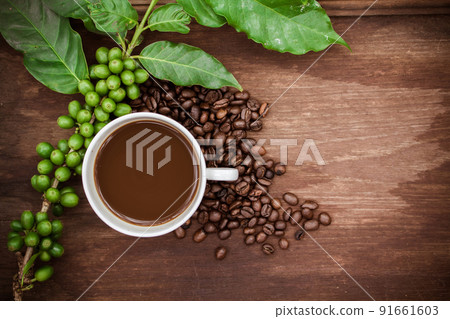 Cup coffee and beans on wood background 91661603