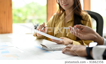 Cropped. Businesswoman talking and planning work with her assistant. 91662356