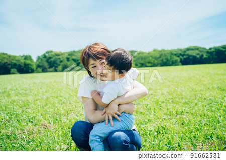 Mother hugging a child Mother hugging a child 91662581