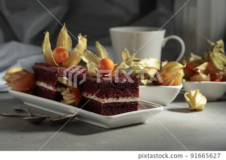 Chocolate cake with physalis. 91665627