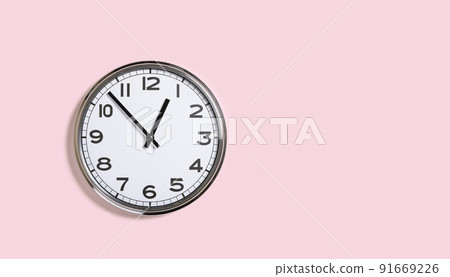 Plain wall clock on pastel pink banner Plain wall clock on pastel pink banner 91669226