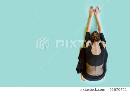 View from top of a woman stretching on yoga mat View from top of a woman stretching on yoga mat 91670721