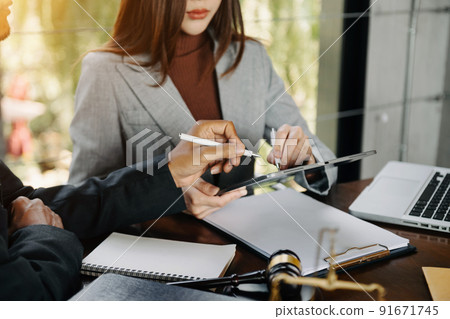 business people and lawyers discussing contract papers sitting at the table. Concepts of law, advice, legal services. in morning light. 91671745