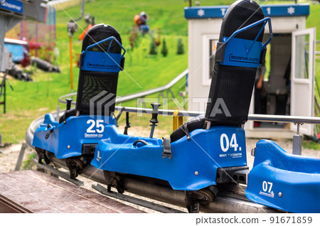 Summer toboggan alpine coaster in the Carpathians in Romania 91671859