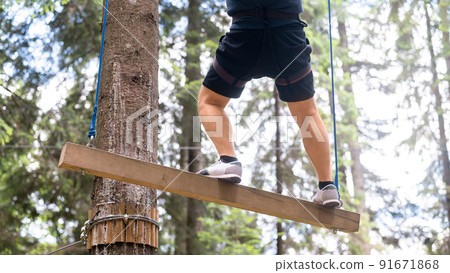 Climbing adventure park in the Carpathians in Romania 91671868