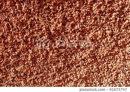 Expanded clay concrete texture. Red pink relief plaster, consisting of expanded clay stones. Abstract background. Expanded clay concrete texture. Red pink relief plaster, consisting of expanded clay stones. Abstract background. 91673747