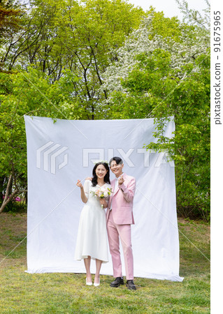 Korean Asian couple self small wedding concept in spring Korean Asian couple self small wedding concept in spring 91675965