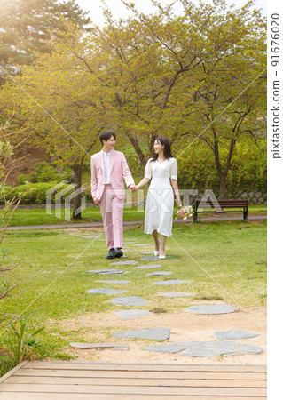 Korean Asian couple self small wedding concept in spring 91676020