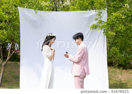 Korean Asian couple self small wedding concept in spring_propose 91676025