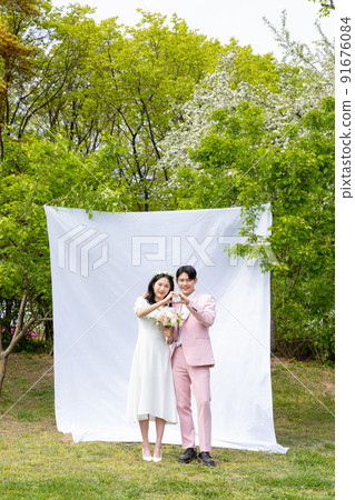 Korean Asian couple self small wedding concept in spring 91676084