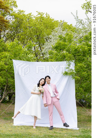 Korean Asian couple self small wedding concept in spring 91676085