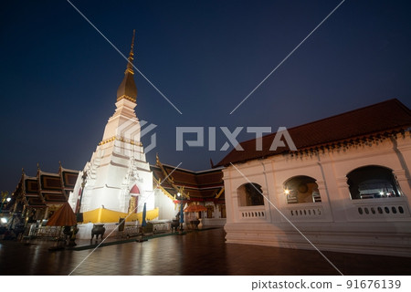 The sunset time at Wat Phra That Choeng Chum Worawihan It is an important sacred place of the city. since ancient times and built in the heart of the city is a precious temple located in Thailand. 91676139
