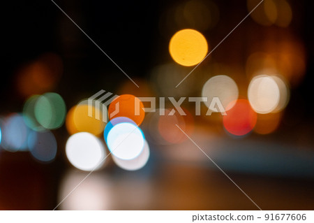 Bokeh traffic light at night in the street of a big city for background Bokeh traffic light at night in the street of a big city for background 91677606