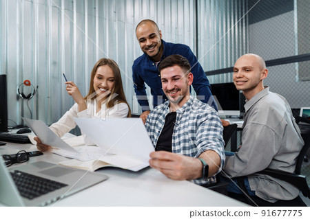 Young business team working on a project in office. Young business team working on a project in office. 91677775