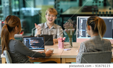 Group of software developers brainstorming and discussion for developing software applications at modern office 91678115