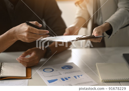 Cropped view of businessman explaining project details, discussing for new strategy of development with colleague Cropped view of businessman explaining project details, discussing for new strategy of development with colleague 91678229