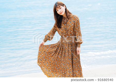 Female portrait on sea background Female portrait on sea background 91680540