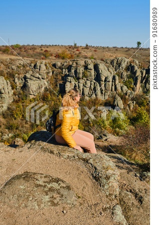 Hiker young woman with backpack on trekking trail Hiker young woman with backpack on trekking trail 91680989