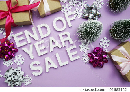 End of Year Sale alphabet letters with gift boxes, snowflake and artificial christmas tree on purple background End of Year Sale alphabet letters with gift boxes, snowflake and artificial christmas tree on purple background 91683132