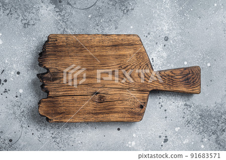 Cooking background with old empty cutting board. Gray background. Top view. Copy space Cooking background with old empty cutting board. Gray background. Top view. Copy space 91683571