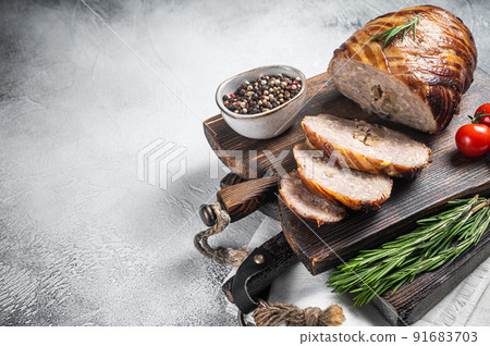 Sliced Rolled meatloaf, ground meat loaf with bacon. White background. Top view. Copy space 91683703
