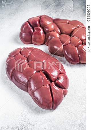 Raw Beef kidney on butcher table. White background. Top view Raw Beef kidney on butcher table. White background. Top view 91684001