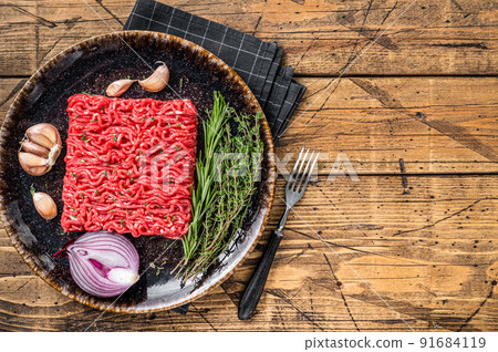 Raw Mince, minced Ground beef and lamb meat. Wooden background. Top view. Copy space Raw Mince, minced Ground beef and lamb meat. Wooden background. Top view. Copy space 91684119