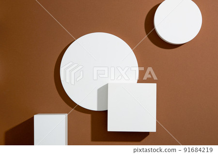 Top view of circle , square white podium , in brown background and blank space for advertising , abstract content Top view of circle , square white podium , in brown background and blank space for advertising , abstract content 91684219