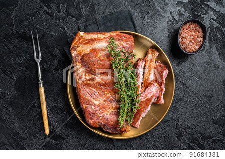 Grilled in BBQ Pork spare Ribs on steel plate with thyme. Black background. Top view 91684381