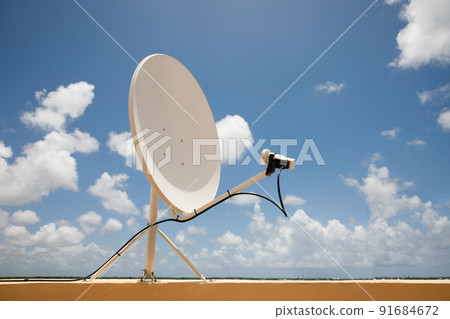 Satellite dish on blue sky background. Parabolic antenna. Reception of the Internet signal from satellites. Satellite dish on blue sky background. Parabolic antenna. Reception of the Internet signal from satellites. 91684672