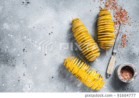 Cooking Tornado or Twist potato fries. Gray background. Top view. Copy space Cooking Tornado or Twist potato fries. Gray background. Top view. Copy space 91684777