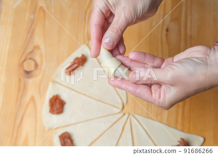 Cooking mini croissants in the kitchen at home Cooking mini croissants in the kitchen at home 91686266