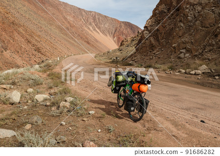 Tourist bike on a mountain road. Tourist bike on a mountain road. 91686282