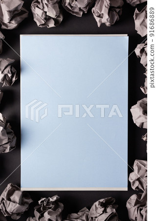 Sheet of paper and crumpled paper balls background texture. Inspiration creative idea concept 91686889