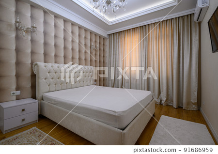 Luxury well designed modern beige master bedroom 91686959