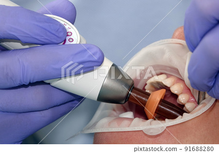 Doctor dentist working with a patient 91688280