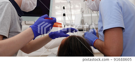 doctor dentist working with a patient shot close-up doctor dentist working with a patient shot close-up 91688605