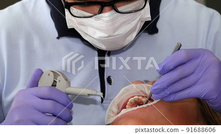 doctor dentist working with a patient shot close-up doctor dentist working with a patient shot close-up 91688606
