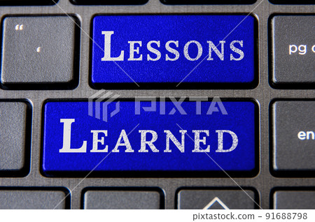 Top view of lessons learned text on laptop keyboard. Learning concept 91688798