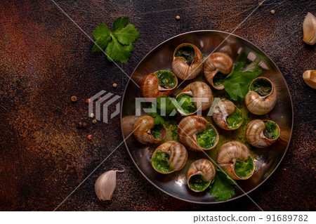 Bourgogne Escargot Snails with herb garlic oil. 91689782