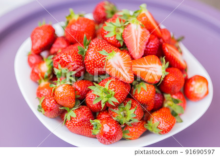 Fresh ripe delicious strawberries in bowl - healthy food and vegetarian Fresh ripe delicious strawberries in bowl - healthy food and vegetarian 91690597