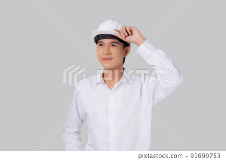 Portrait young asian man is engineer wearing helmet standing and smiling with confident isolated. 91690753