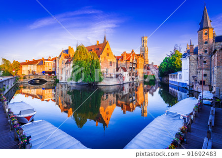 Bruges, Belgium. Sunrise on Rozenhoedkaai, old town with Belfry reflection 91692483