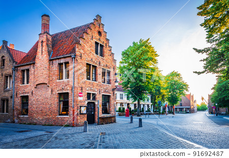Bruges, Belgium. Sunrise light on Mariastraat, historical Brugge, Flanders. Bruges, Belgium. Sunrise light on Mariastraat, historical Brugge, Flanders. 91692487
