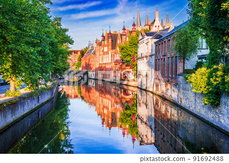 Bruges, Belgium. Sunlight over Groenerei canal, Meebrug bridge. Bruges, Belgium. Sunlight over Groenerei canal, Meebrug bridge. 91692488