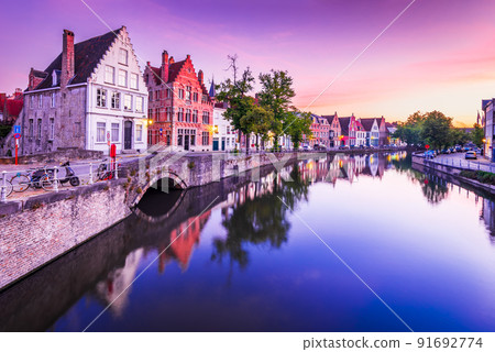 Bruges, Belgium. Sunrise over Spiegelrei Canal, Flanders famous city. Bruges, Belgium. Sunrise over Spiegelrei Canal, Flanders famous city. 91692774